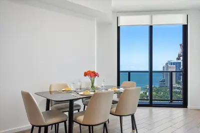 a dining room with a table and chairs with a view at MVR - Only for VIP Travelers - Luxe Stay in Downtown in Miami