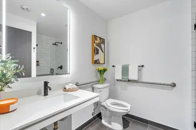 a white bathroom with a toilet and a sink at MVR - Only for VIP Travelers - Luxe Stay in Downtown in Miami
