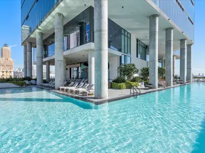 a swimming pool in front of a building at MVR - Only for VIP Travelers - Luxe Stay in Downtown in Miami