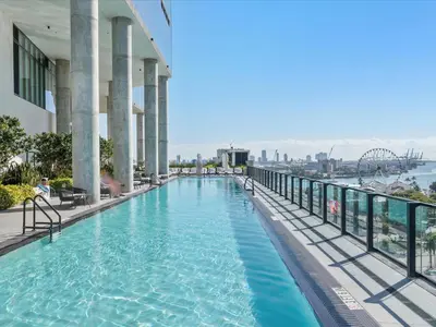a swimming pool on top of a building with a view of the city at MVR - Miami-s #1 Rated 1BR - Sup3rhost Approved in Miami