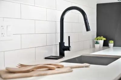 a kitchen sink with a faucet and wooden utensils at MVR - SupErhost Stay 10 Yrs of 5-Star Service in Miami