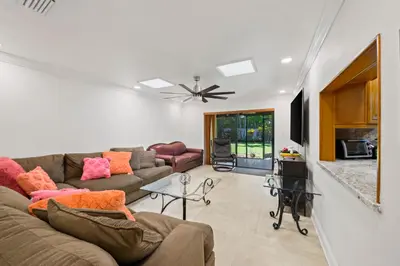 a living room with a couch and a table at Luxury Queen Room, Walk to UM, Free Car Service! in Miami