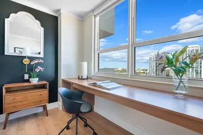 a home office with a desk and a window at MVR Relax in Suite with Biscayne Bay Sunsets in Miami