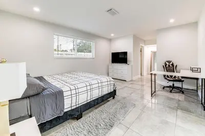a bedroom with a bed and a desk and a computer at Outdoor Oasis with Games Sleek Hollywood Home! in Hollywood