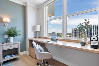 a room with a desk with a laptop and a window at MVR - A Suite That-s Actually as Good as It Looks in Miami