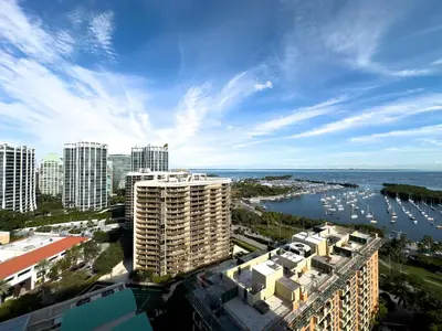 a view of a city with buildings and the ocean at MVR - Limited Bay View Suites-Book Fast in Miami