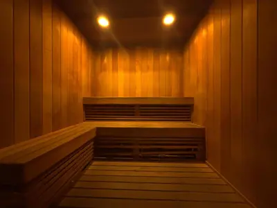 a sauna with wood paneling and two lights on at MVR Suite Boutique Living with Big Luxury Energy in Miami