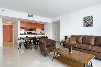 a living room with a couch and a table at Spacious Penthouse in Brickell 3 BR, Free Parking in Miami