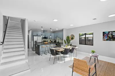 a kitchen and dining room with a table and chairs at Spacious 4-BR House W Free Parking in Miami