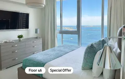 a bedroom with a bed with a view of the ocean at MVR An Unforgettable View Awaits You in Miami