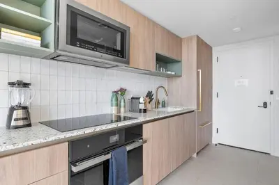 a kitchen with a sink and a microwave at MVR Skyline Luxury in Downtown Miami in Miami