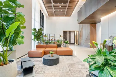 a lobby with a couch and a table and plants at MVR Skyline Luxury in Downtown Miami in Miami