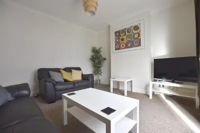 a living room with a couch and a tv at Gorgeous apartment near South Beach in Miami Beach