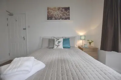 a bedroom with a large bed with a white bedspread at Gorgeous apartment near South Beach in Miami Beach