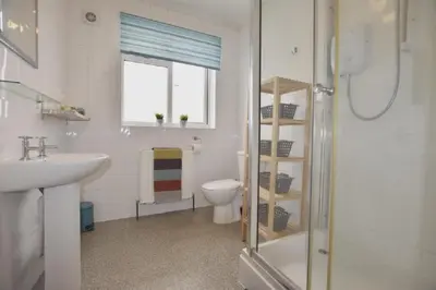 a bathroom with a shower and a toilet and a sink at Gorgeous apartment near South Beach in Miami Beach
