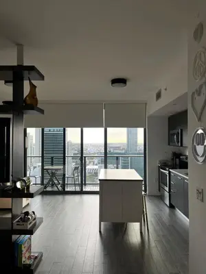 a kitchen with a table and a view of the city at Luxury Studio in Miami