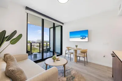 a living room with a couch and a table at Luxury Miami Beach Condo At 72 Park in Miami Beach
