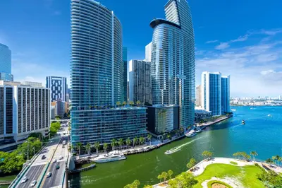 a city with tall buildings next to a river at Icon Brickell 2BR Poolside Paradise in the Sky in Miami