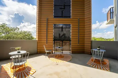 two chairs and a table on a patio at Lux Design Apartment near beach in Fort Lauderdale
