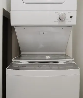 a white stove top oven in a white refrigerator at Lux Design Apartment near beach in Fort Lauderdale