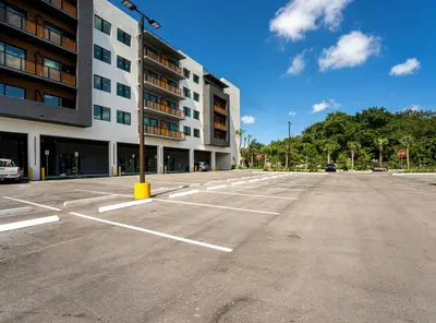 an empty parking lot in front of a building at Lux Design Apartment near beach in Fort Lauderdale