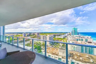 a balcony with a view of the ocean and buildings at Beachfront Luxury Condo in Hollywood in Hollywood