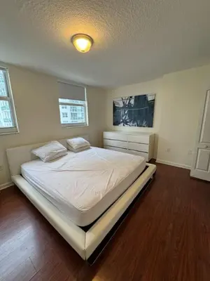 a bedroom with a large white bed in it at Bright 2BR Apartment in Prime Brickell Location in Miami