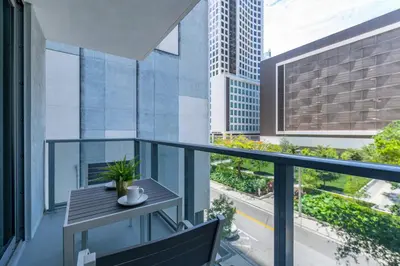 a balcony with a table and a view of a city at Spacious and bright in the heart of Brickell in Miami