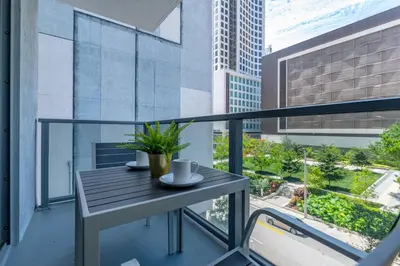 a balcony with a table and a view of a city at Spacious and bright in the heart of Brickell in Miami
