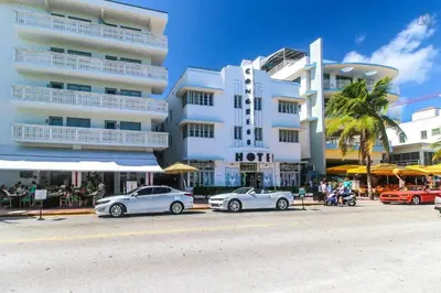 a group of cars parked in front of a building at Ocean Drive Studio Roof top Pool and Bar in Miami Beach