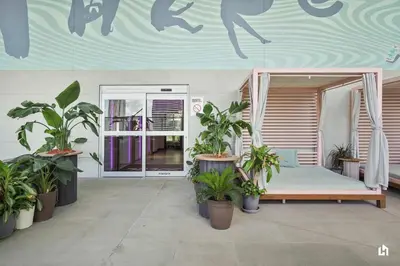 a room with a bed with plants in it at Downtown Vibes Pool Gym & Oceanview in Miami