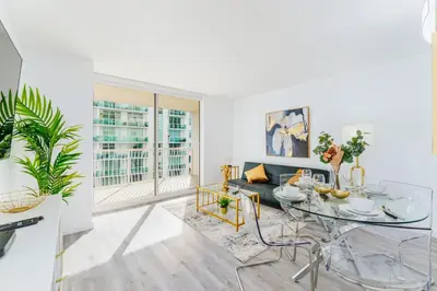 a living room with a glass table and a couch at Fantastic APT Brickell in Miami
