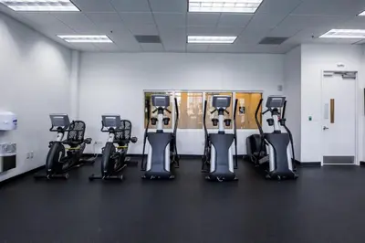 a gym with a row of exercise bikes at Fantastic APT Brickell in Miami
