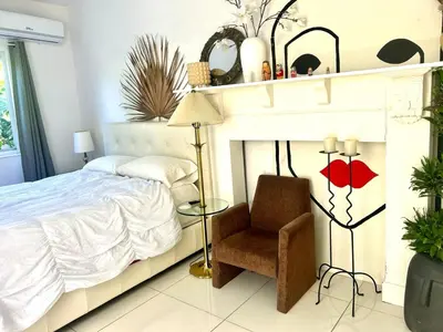 a bedroom with a bed and a chair at Retreat Independent Entire Room in Princeton