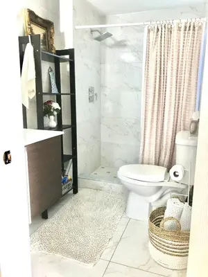 a bathroom with a toilet and a sink and a shower at Retreat Independent Entire Room in Princeton