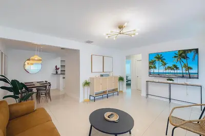 a living room with a couch and a table at Stylish 2BR Getaway - Prime Miami Location in Miami