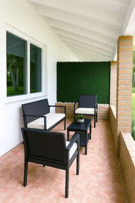 a group of chairs and tables on a patio at Stylish 2BR Getaway - Prime Miami Location in Miami