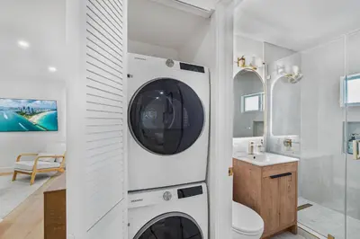 a washer and dryer in a bathroom with a sink at Chic Villa Nina 2 bedrooms 2 baths in Miami! in North Miami