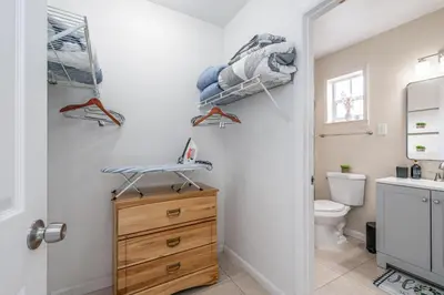 a bathroom with a sink and a toilet and a door at Golden Welcome in Hollywood
