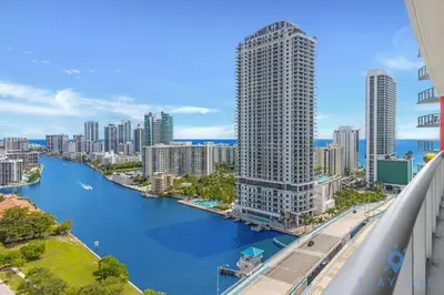 a view of a city with a river and buildings at Infinite Views - Private Balcony -Poolside Bliss Near the Beach in Hallandale Beach
