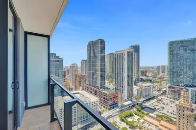 an apartment balcony with a view of a city at Lux Miami Studio City Bay Views in Miami