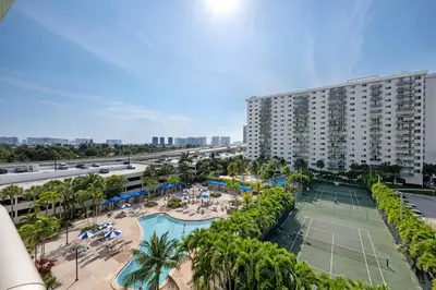 an aerial view of a resort with a tennis court at Entire Condominium in Sunny Isles in Sunny Isles Beach