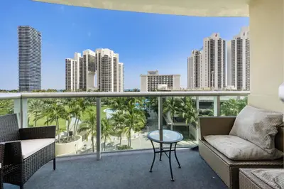a balcony with a view of the city at Bright Stylish 2BR Condo Stunning View Of Ocean in Sunny Isles Beach