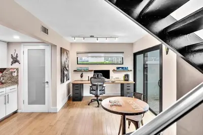 an office with a desk and a chair and a table at Coconut Grove Haven Family in Miami