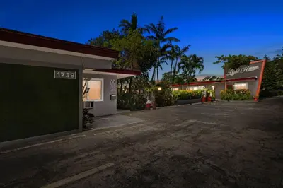 an empty parking lot in front of a gas station at 1BR Studio Parking, Pet Friendly and BBQ Area in Hollywood