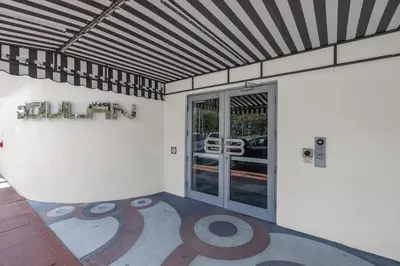 an empty room with a room with a large door at Large Beach Suite Rooftop Pool by Convention Center in Miami Beach