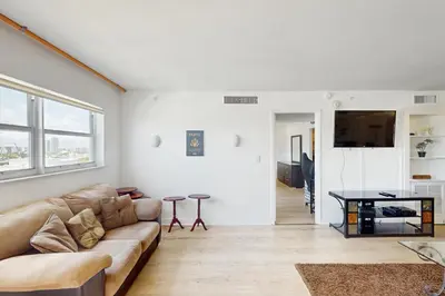 a living room with a couch and a table at Miami Lux Haven in Miami Beach