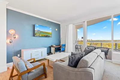 a living room with a couch and a table at Luxury Condo at Trésor Miami Beach in Miami Beach