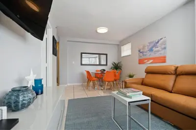a living room with a couch and a table at South Beach Luxury, 2 Bedroom, Across from Beach in Miami Beach