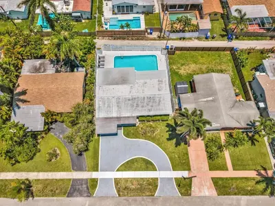 an overhead view of a house with a swimming pool at 4BR Home Heated Pool And BBQ short drive Beach! in Hollywood